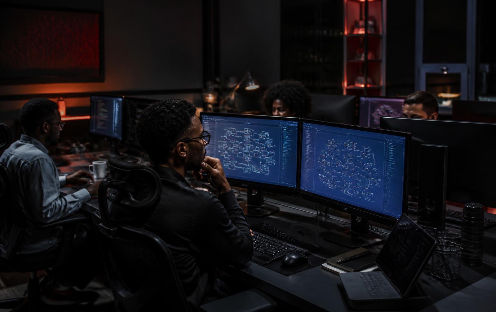 Engineers working late in a modern African software studio